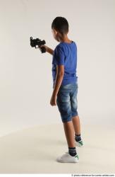 TIMBO STANDING POSE WITH GUN